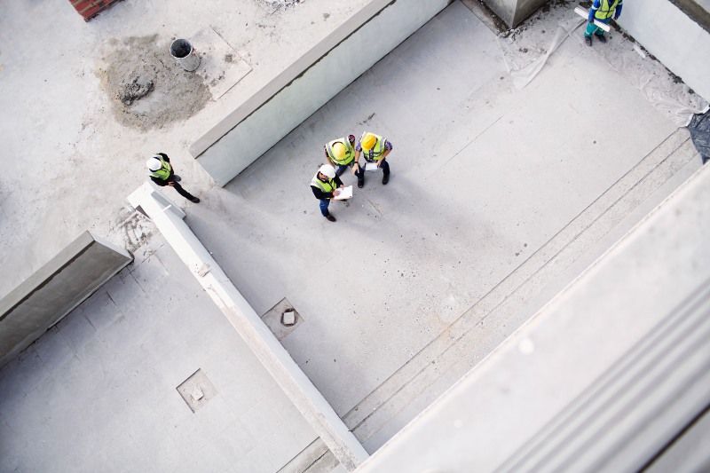 Two Construction workers working on a construction site in Texas and Louisiana.