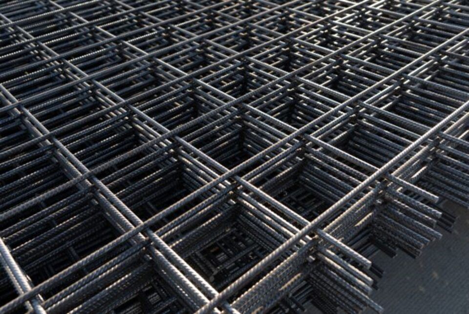 A close-up of a large steel mesh grid, revealing its robust design and material in TX and LA
