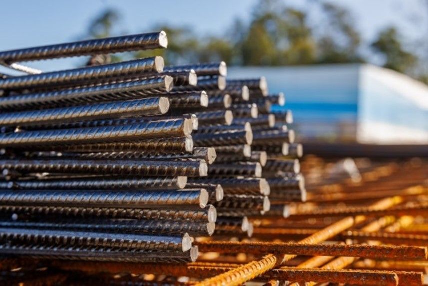 A stack of steel rods arranged neatly, highlighting their metallic texture, found in TX and LA