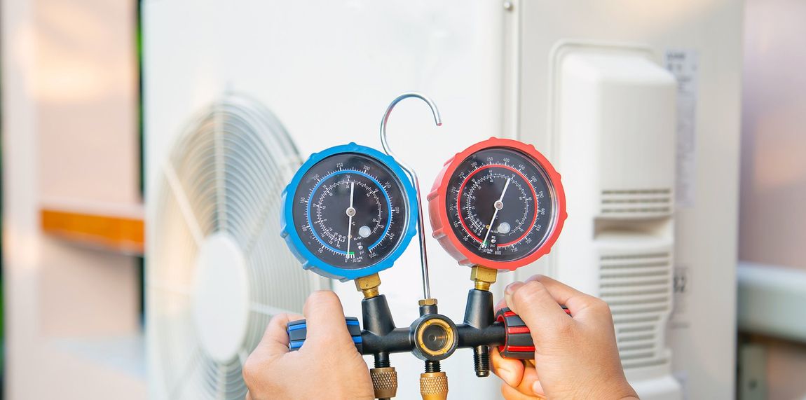 Using A Measuring Tool To Check Air Conditioner — West Ivins, UT — Airco Heating & Cooling Inc Using A Measuring Tool To Check Air Conditioner — West Ivins, UT — Airco Heating & Cooling Inc