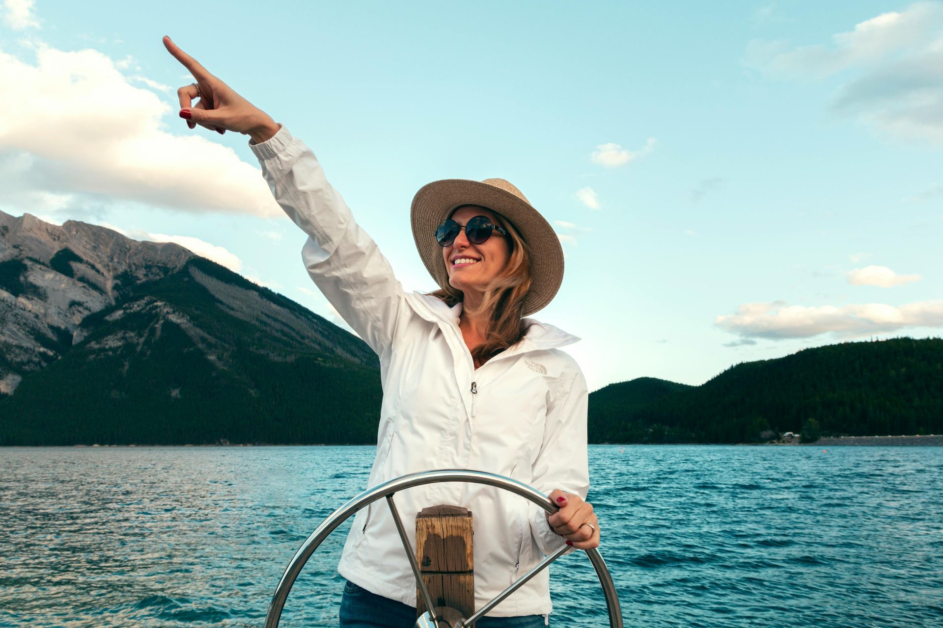 Women enjoying herself steering boat