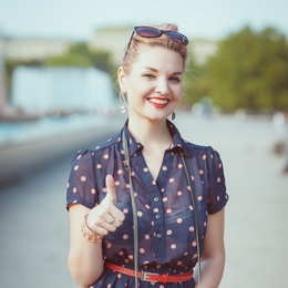 woman with reignited joy and thumb up