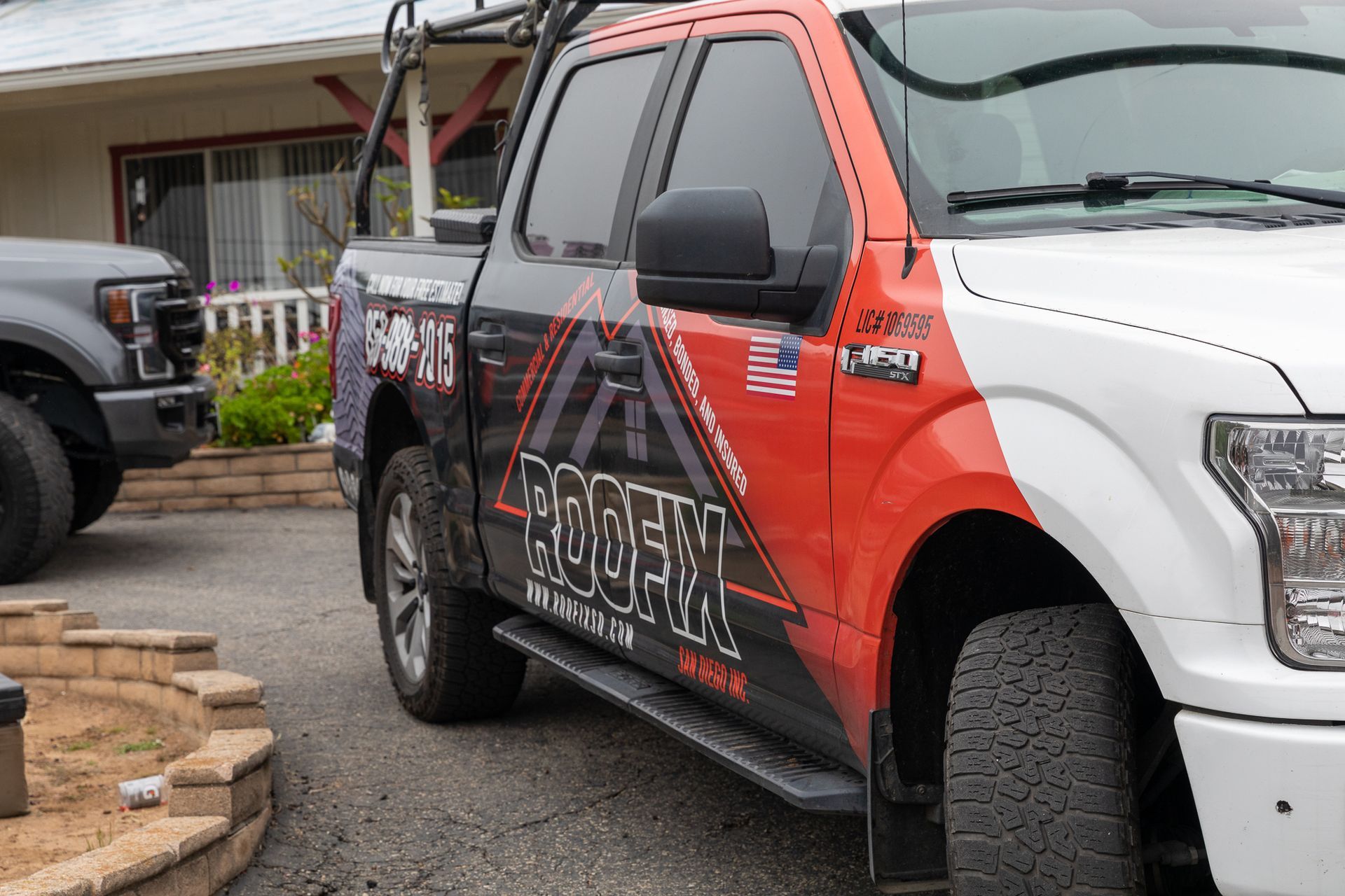 A red and white truck with the word phoenix on the side