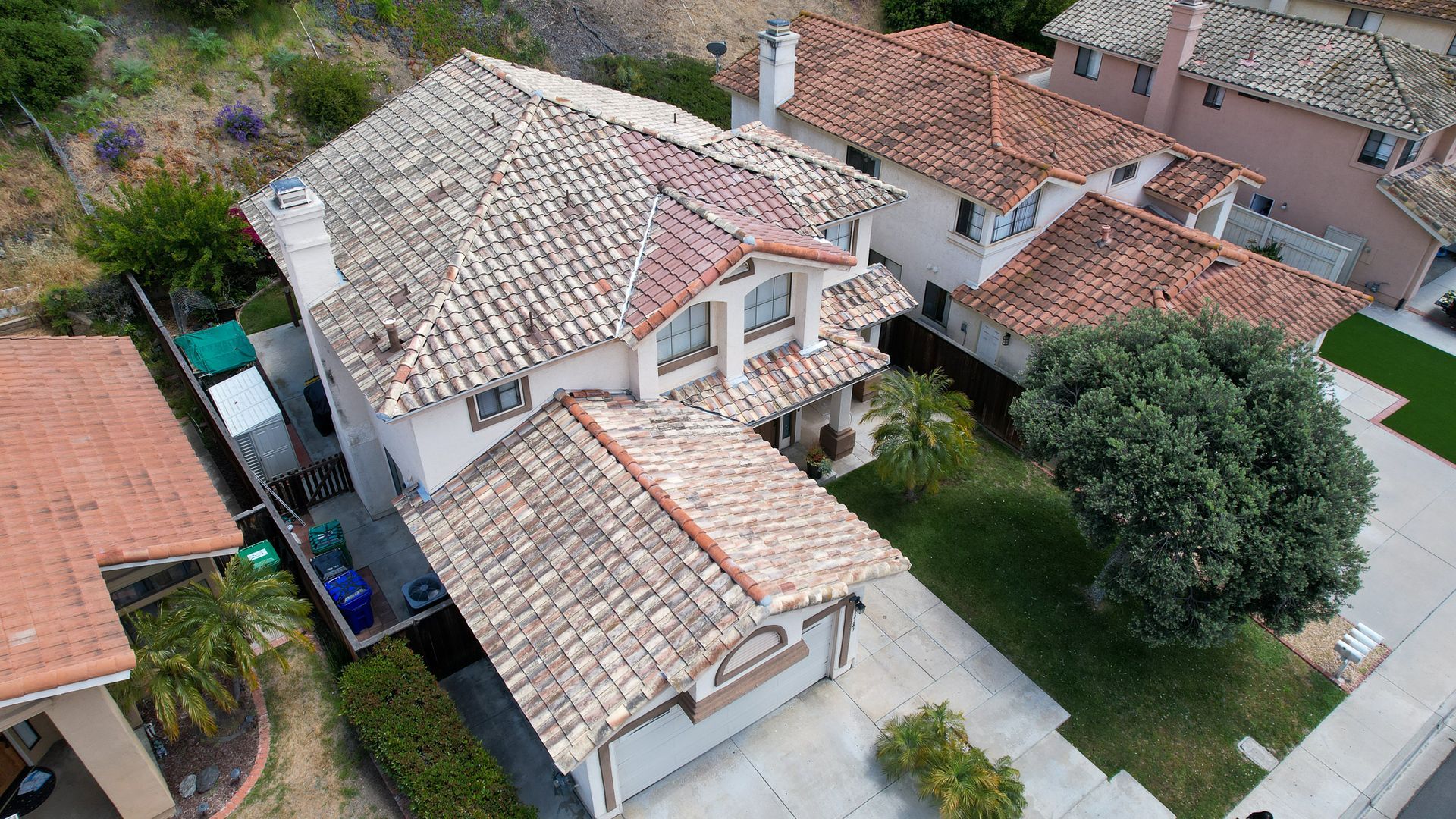 An aerial view of a house with a tiled roof