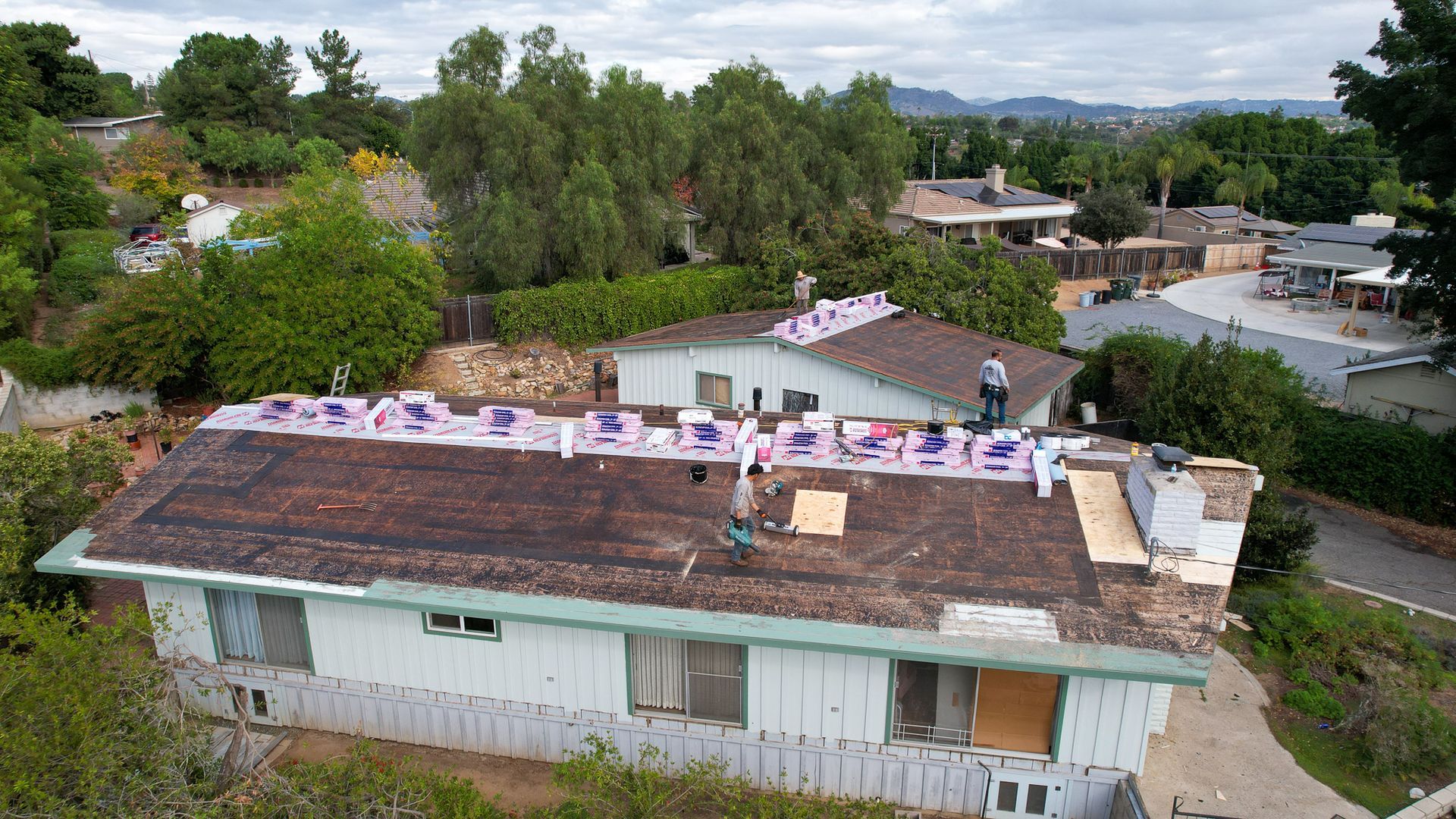 An aerial view of a house that is being remodeled