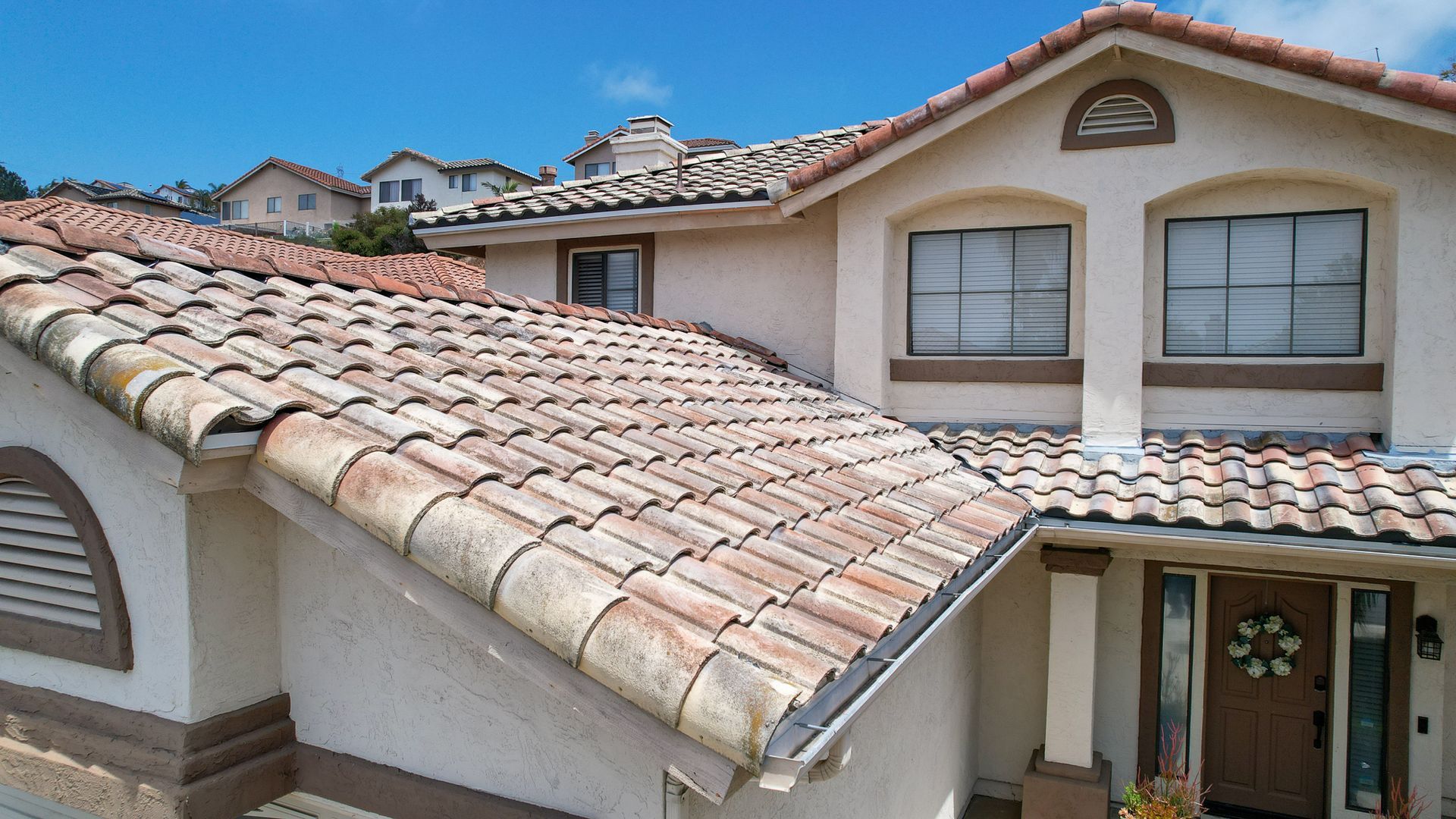 A house with a tiled roof and arched windows