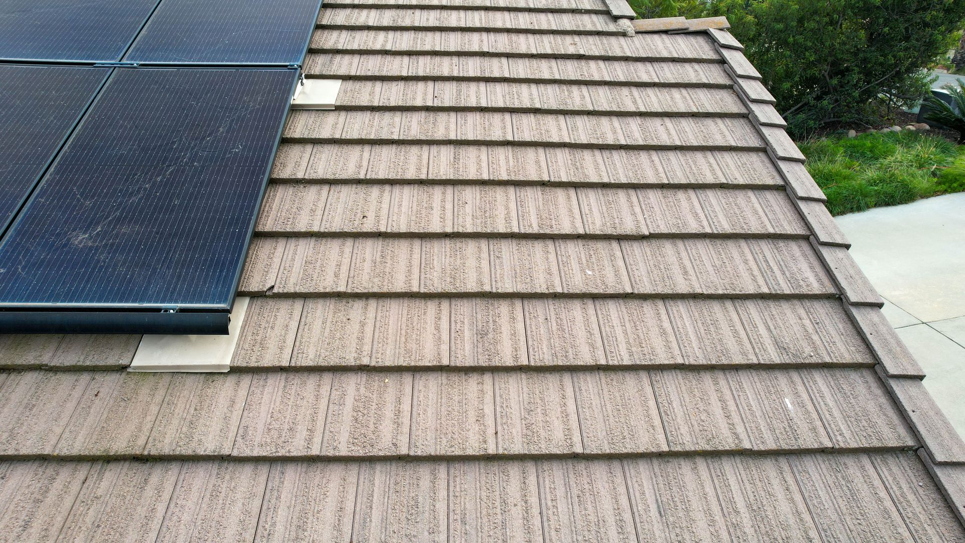 A roof with a solar panel on top of it