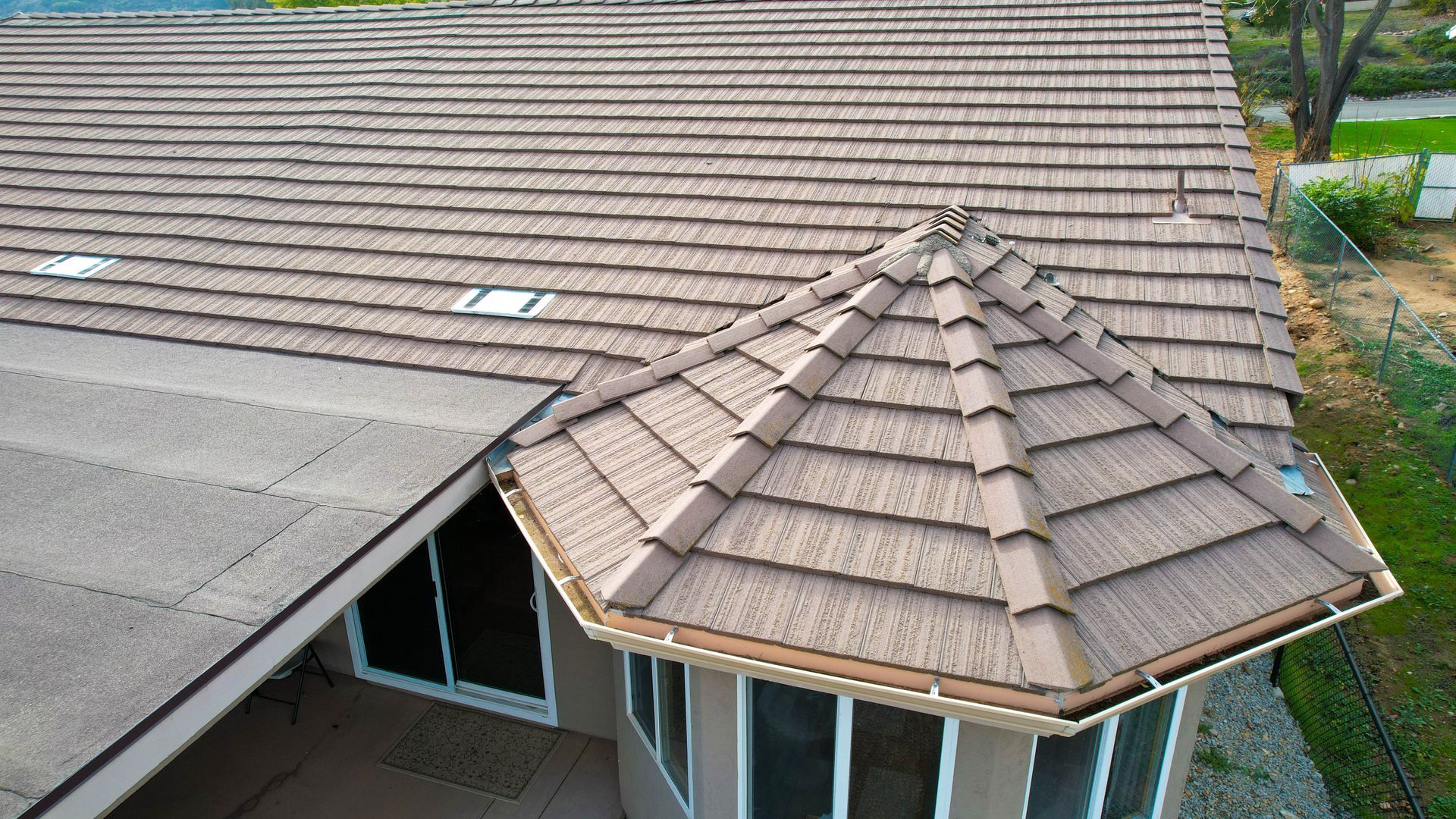 An aerial view of a house with a tiled roof