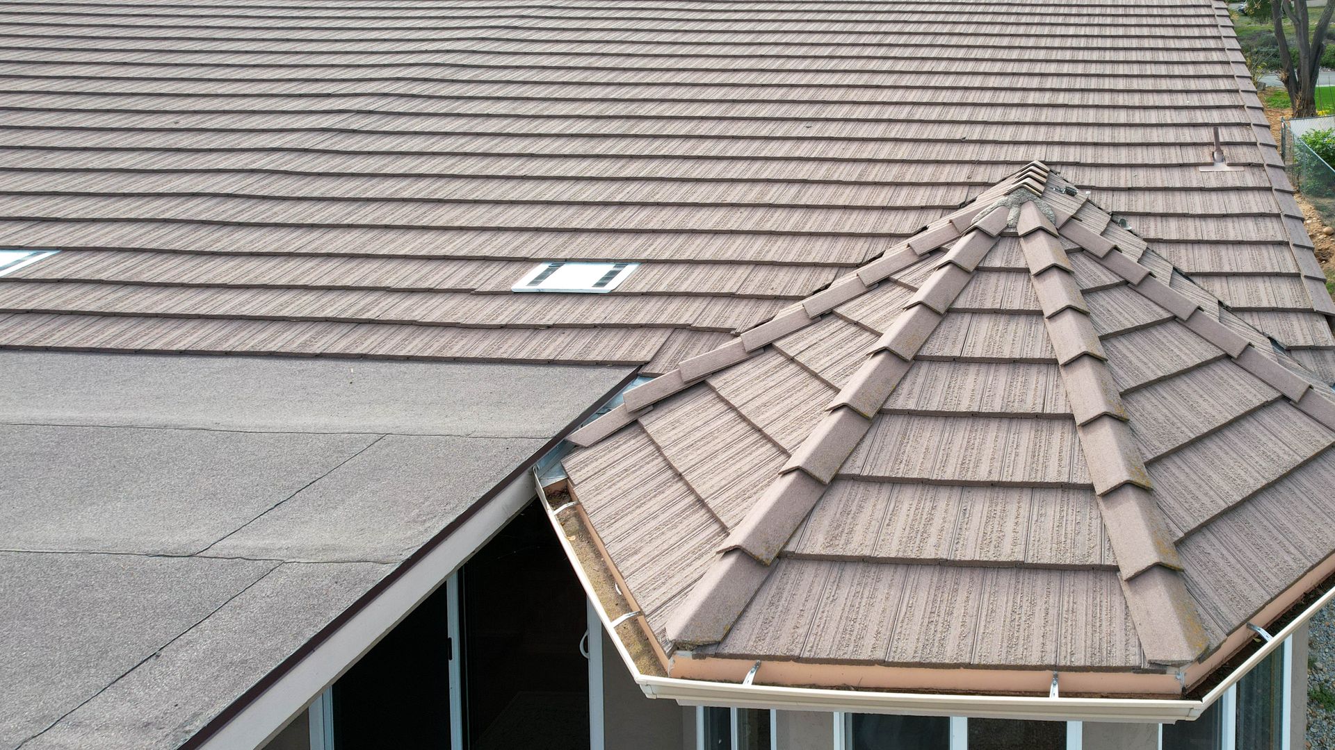 A house with a roof that has shingles on it