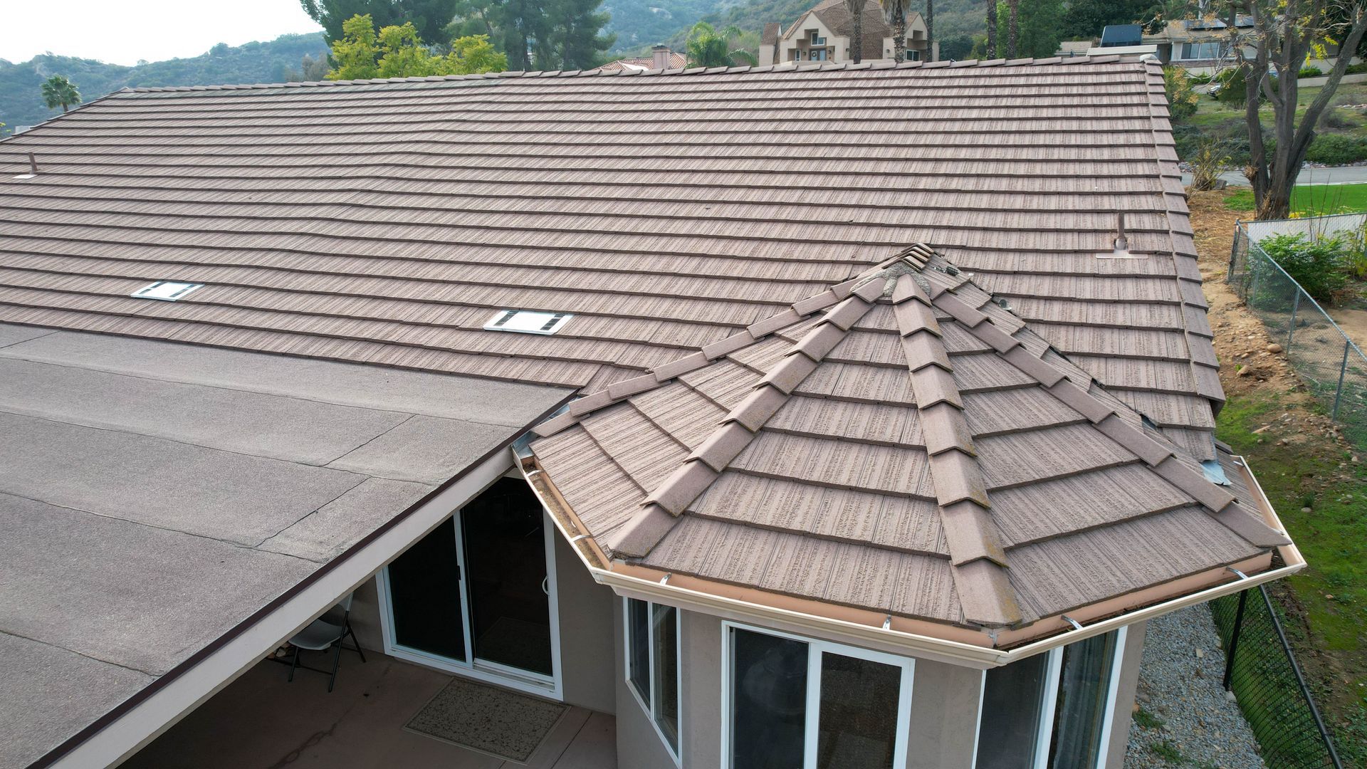 An aerial view of a house with a tiled roof