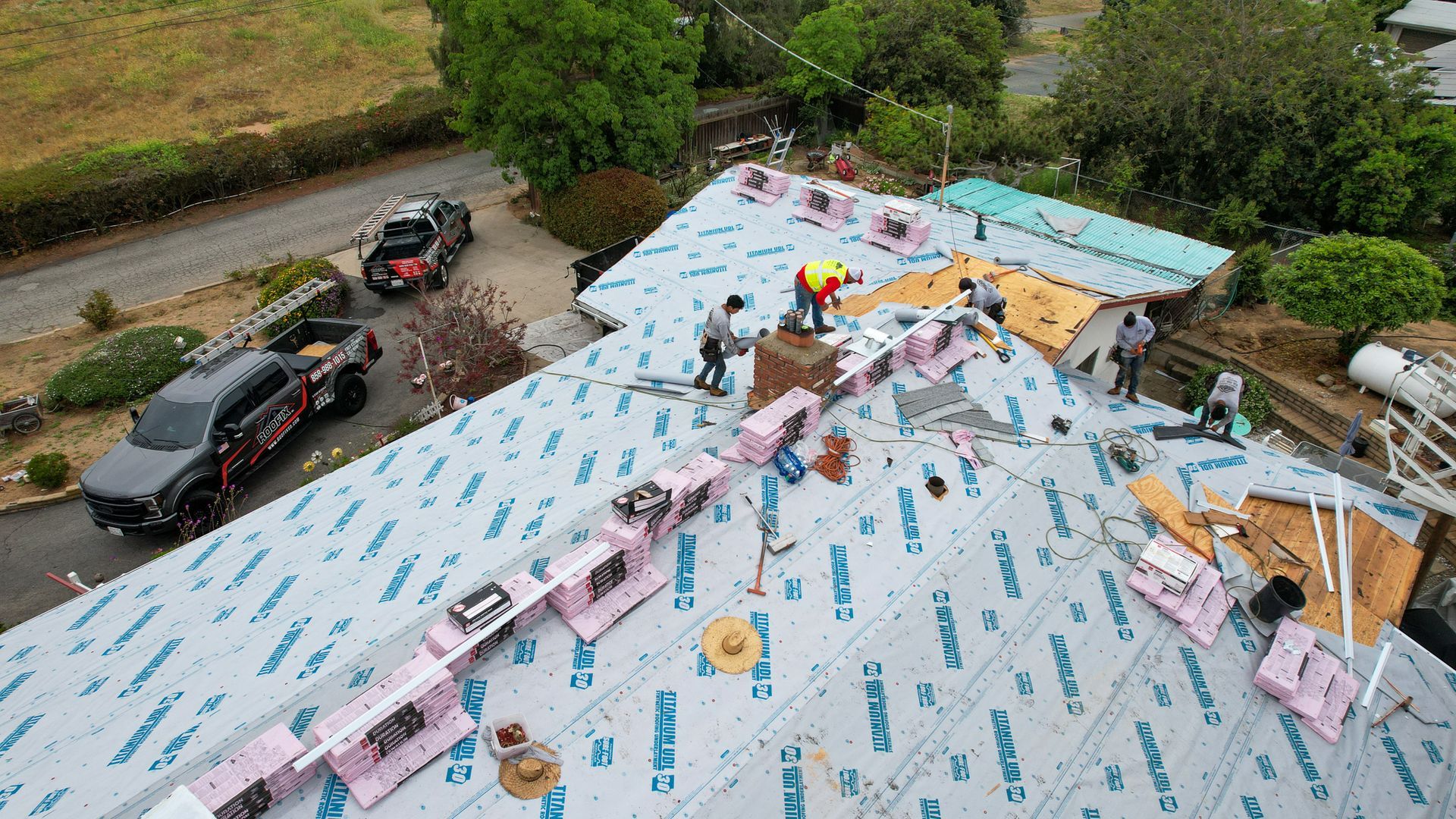 An aerial view of a roof that is being installed