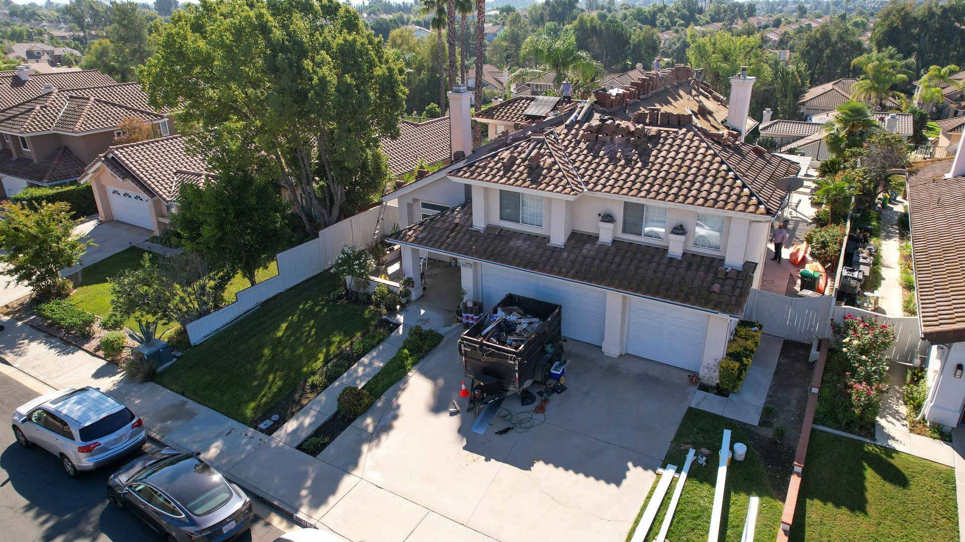 An aerial view of a house with a truck in the driveway