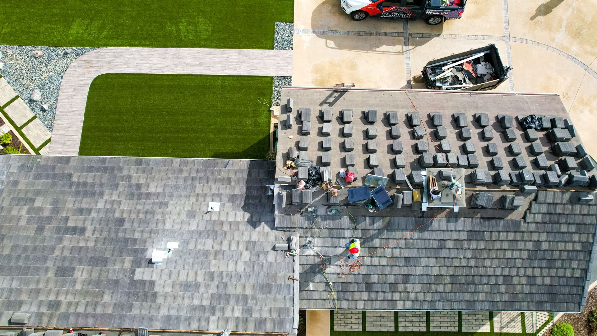 An aerial view of a roof that is being installed