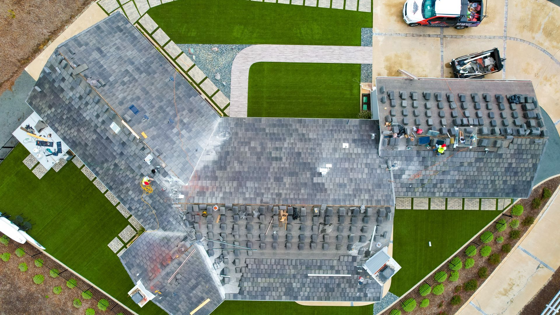 An aerial view of a large house under construction