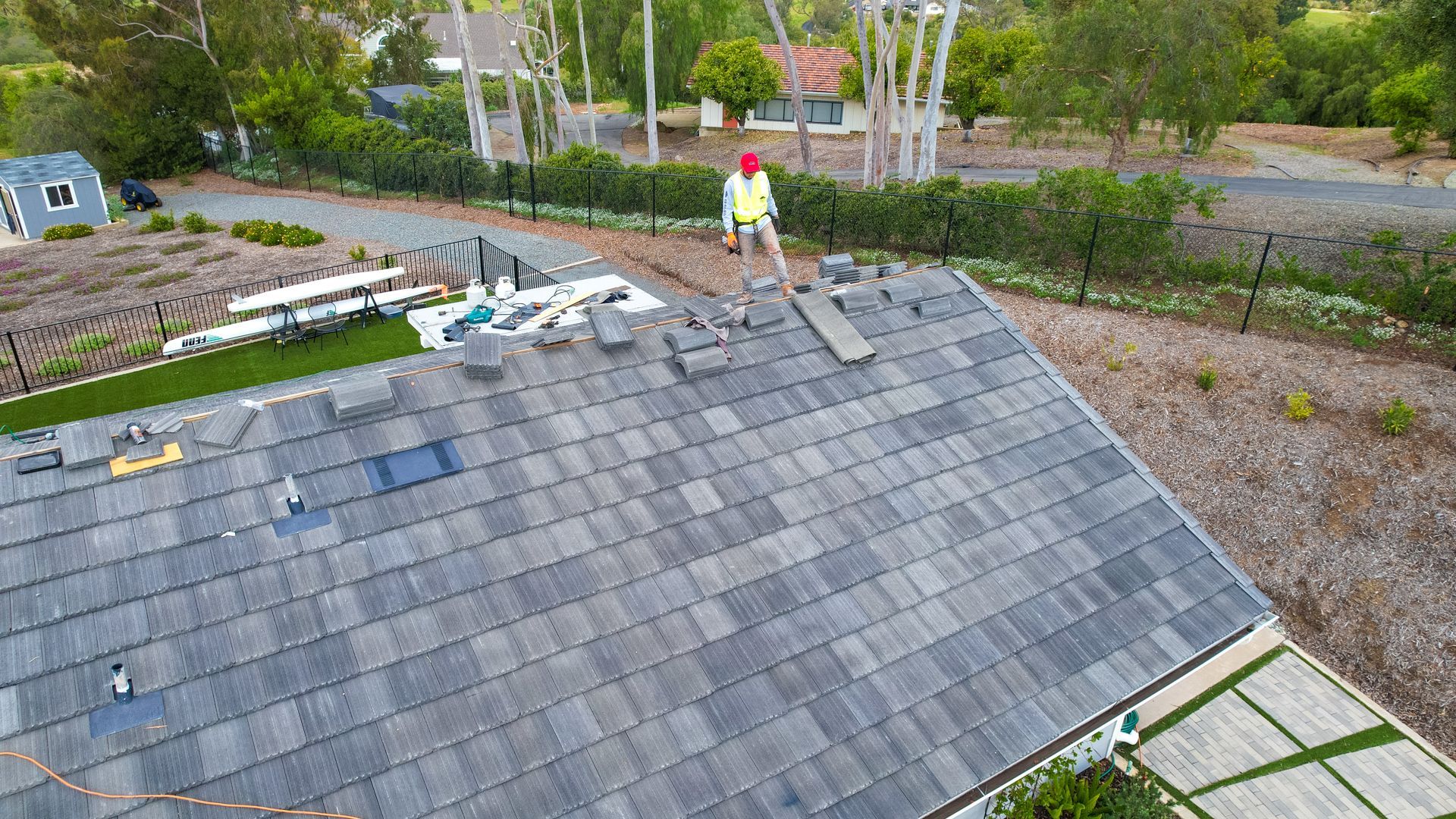 An aerial view of a man standing on top of a roof