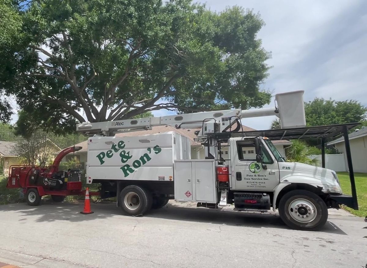 A white truck with pete and ron 's written on it