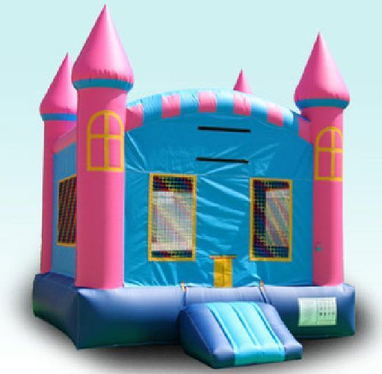 Pink-and-blue inflatable bounce house with a front slide and turrets