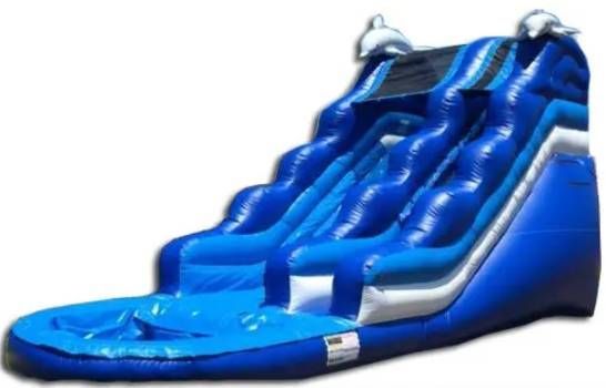 Blue inflatable water slide with a curved ramp and splash pool at the bottom
