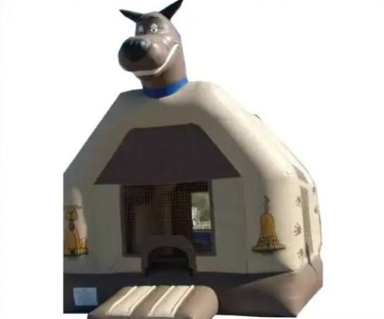 Inflatable dog house bounce house with a large dog head on top and a front entrance