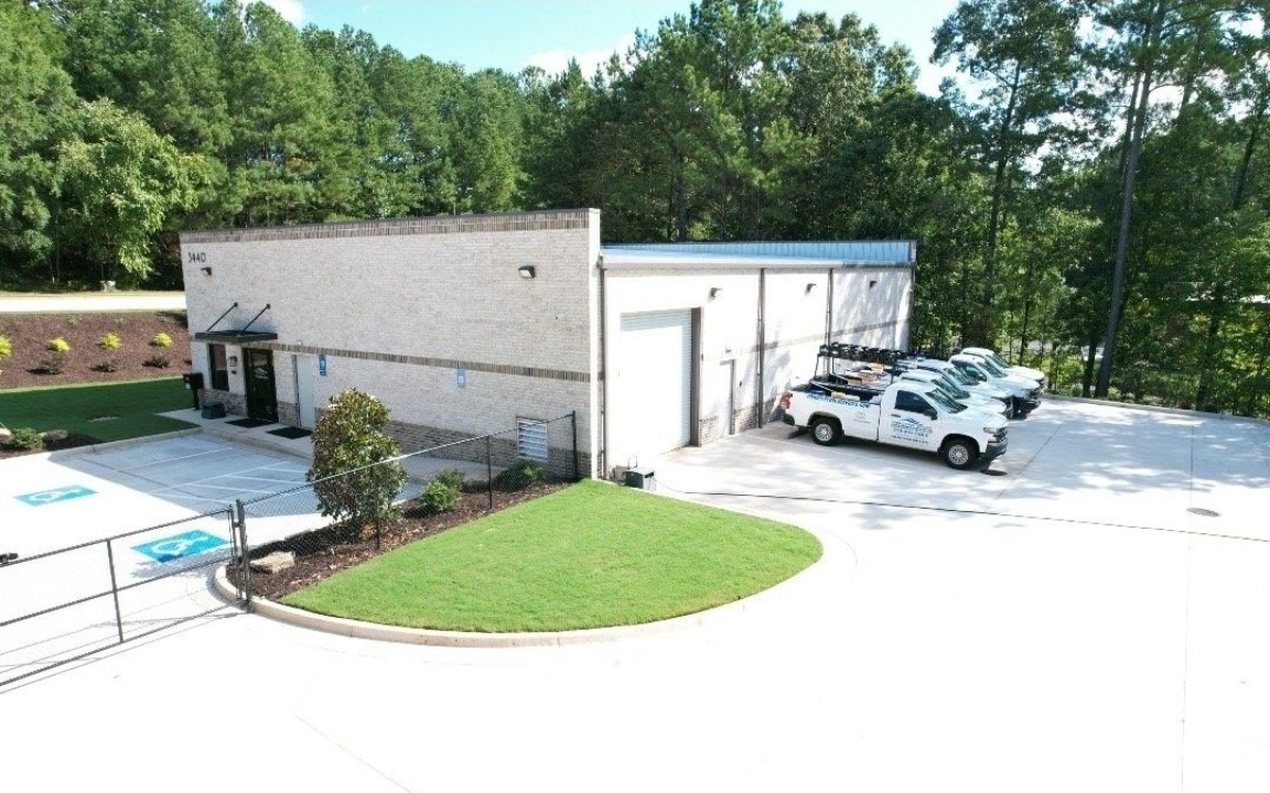 Pinnacle Pool Services workshop in Duluth GA with fleet of service trucks
