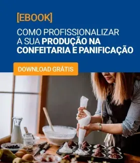 Dois homens estão olhando para um laptop em uma padaria.