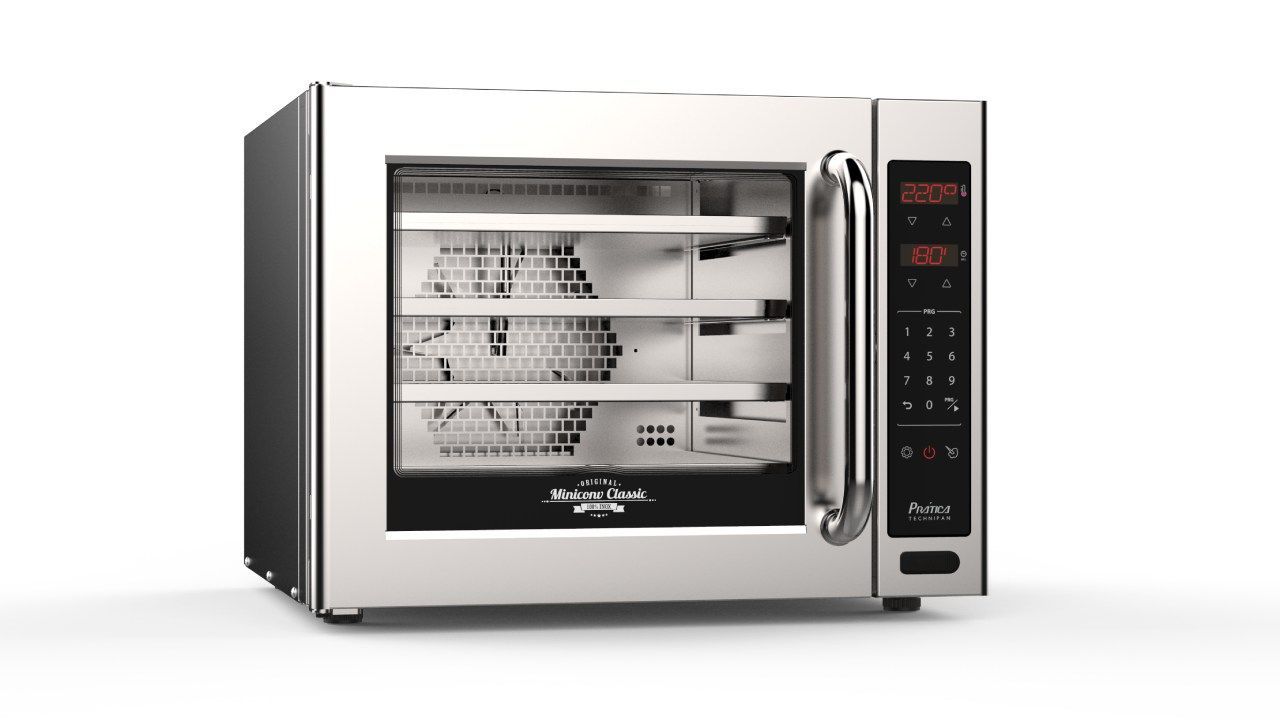 Um forno de aço inoxidável está sobre uma superfície branca.