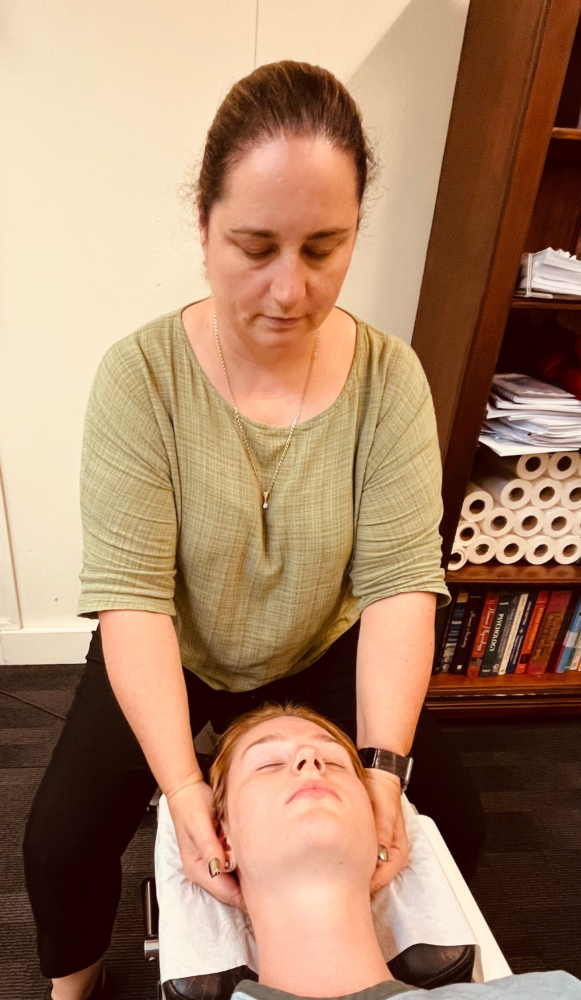 Hands Performing Hand Massage on Another Person's Arm — Axis Chiropractic In Cairns City, QLD