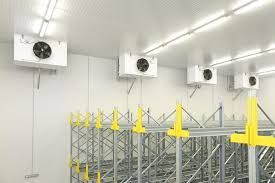 a warehouse with a lot of shelves and fans on the ceiling. Industrial Cold Storage
