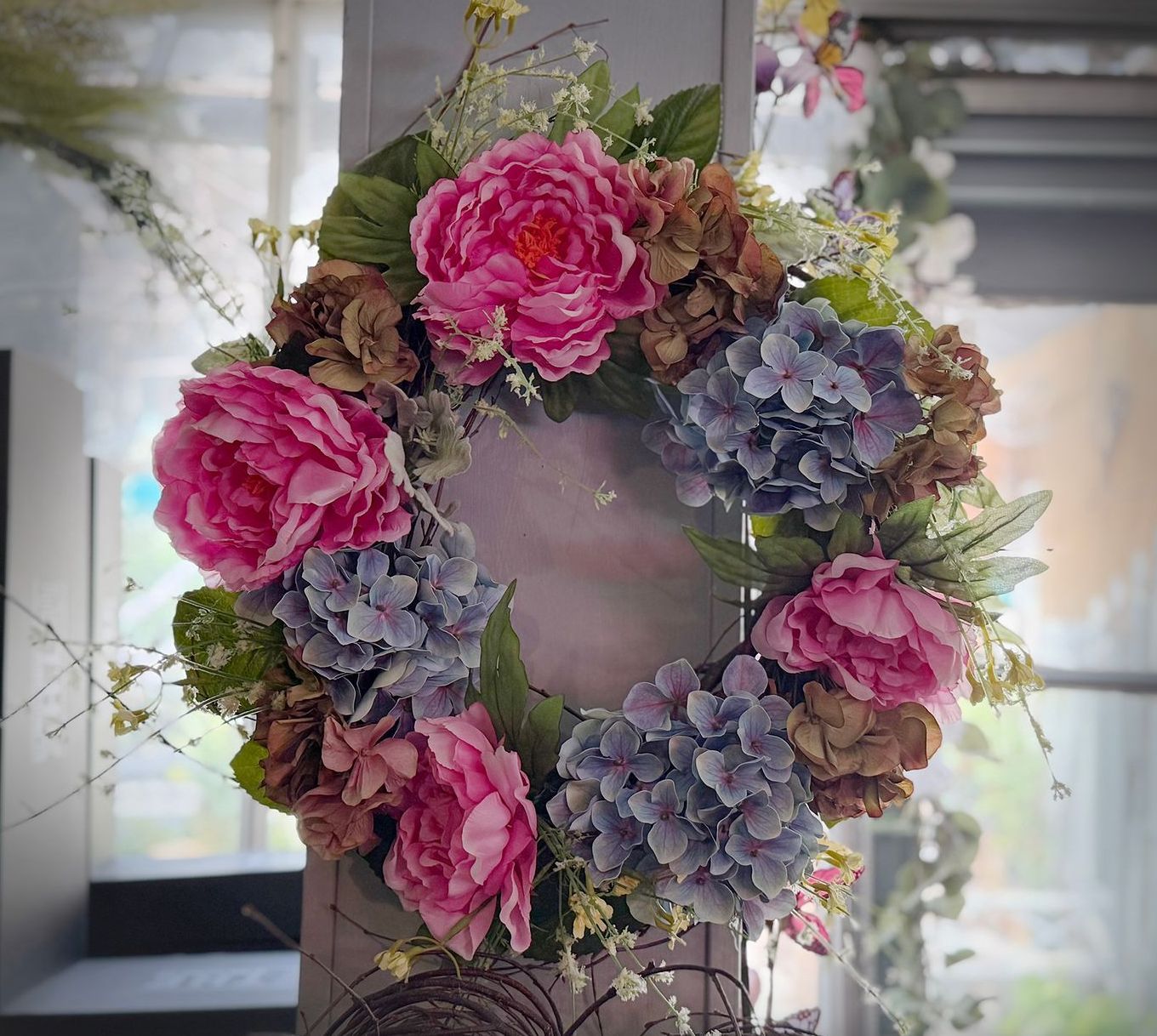 silk flower wreath with purple and pink flowers