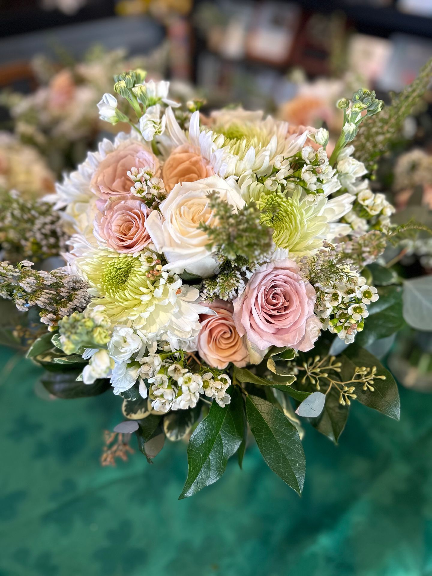 A bridal bouquet is sitting on a table.