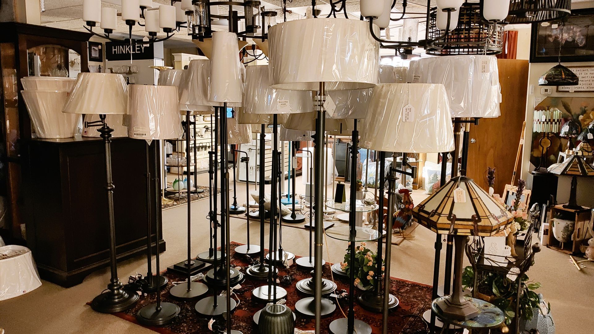 Inventory of premium floor lamps including torchiere and club styles at Avon Lighting Showroom