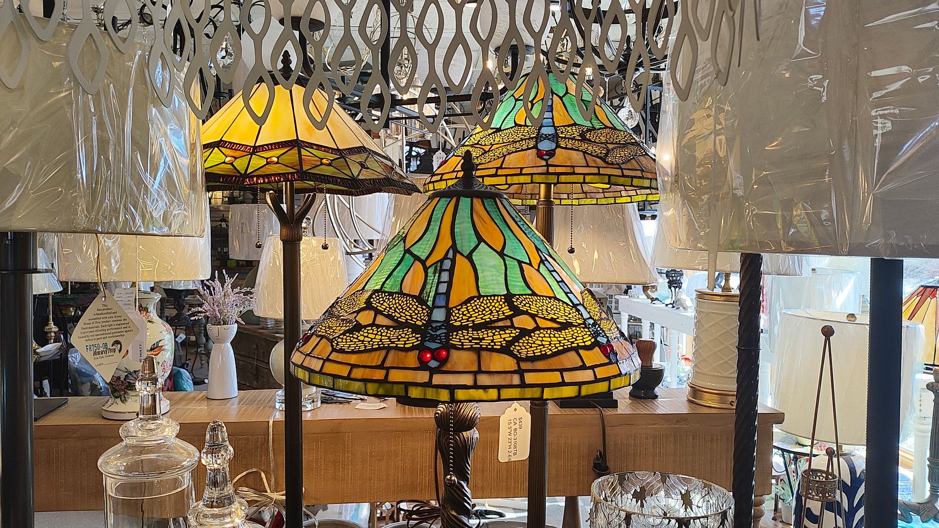 A bunch of tifany lamps are lined up in a retail lighting store in Connecticut