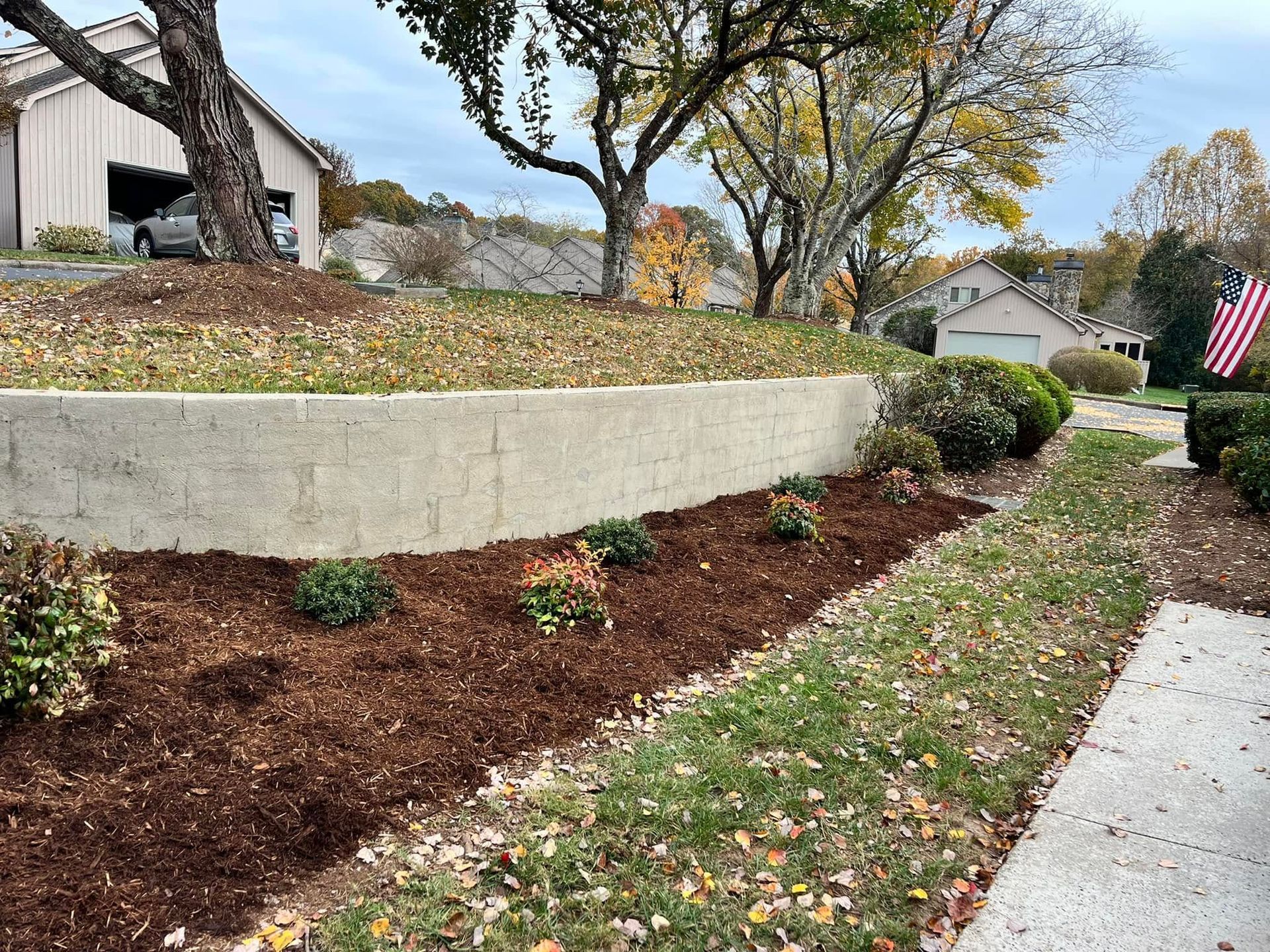 Seat wall and fire pit area set into a backyard patio on a Catawba County property
