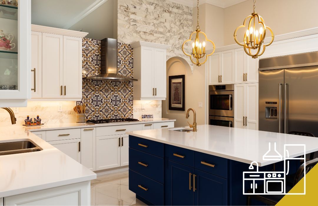Modern kitchen with white cabinets, blue island, gold accents, and pendant lights.