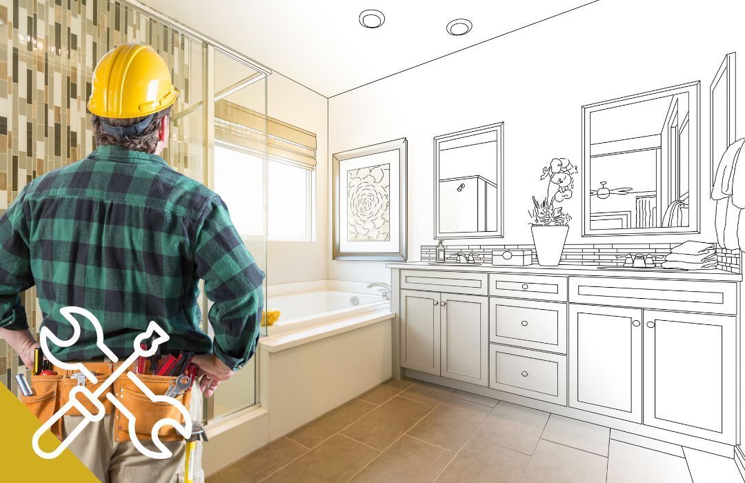 A worker in a hard hat surveys a bathroom remodel, half finished with sketched details.