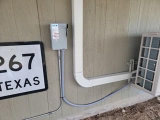 There is a sign on the side of a building that says 267 texas.