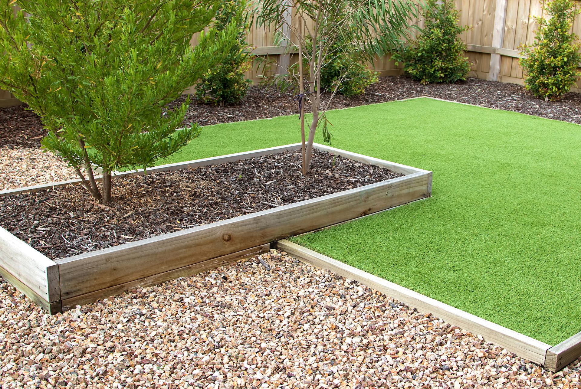 A lawn with a tree in the middle of it