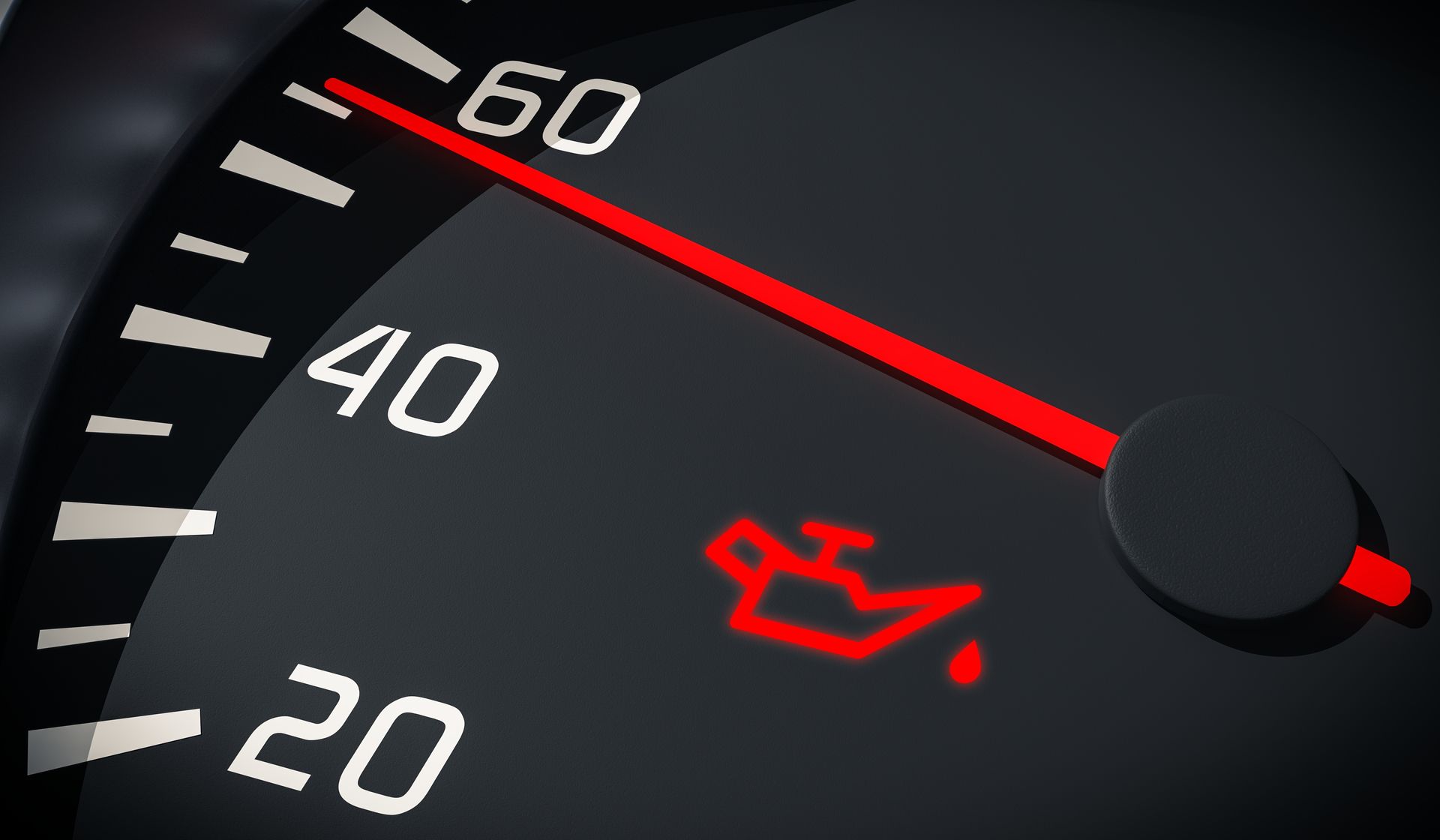 Dashboard oil pressure gauge showing low pressure, with oil can warning light illuminated.