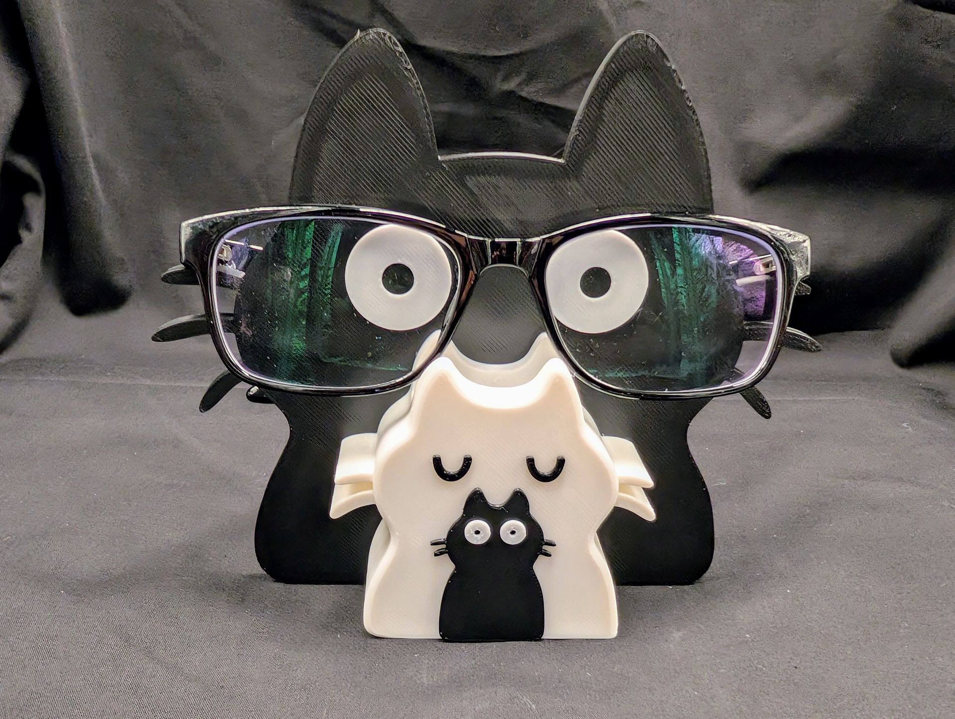 Cat family with one kitten glasses and pen holder.