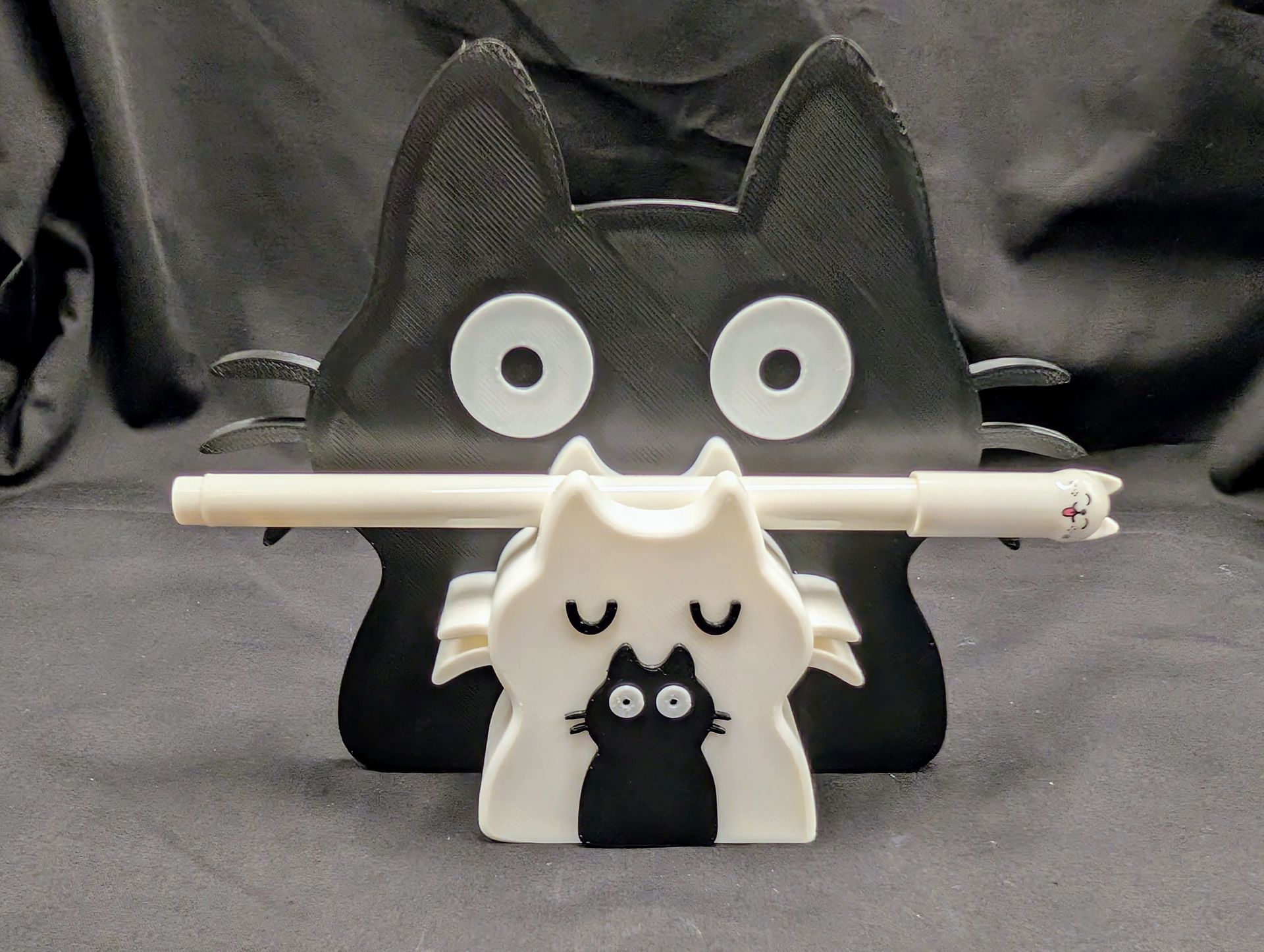 Cat family with one kitten glasses and pen holder.