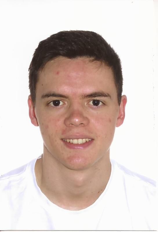 A headshot of a person with dark hair, light skin, and a neutral expression, wearing a white shirt against a white backdrop.