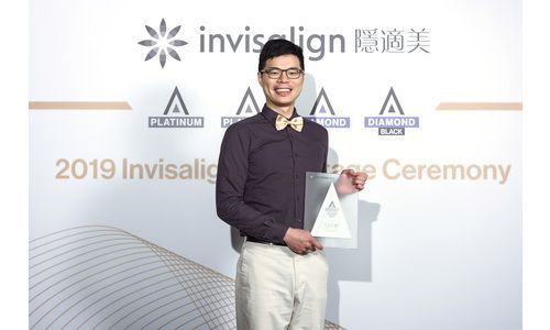 Man with holding award