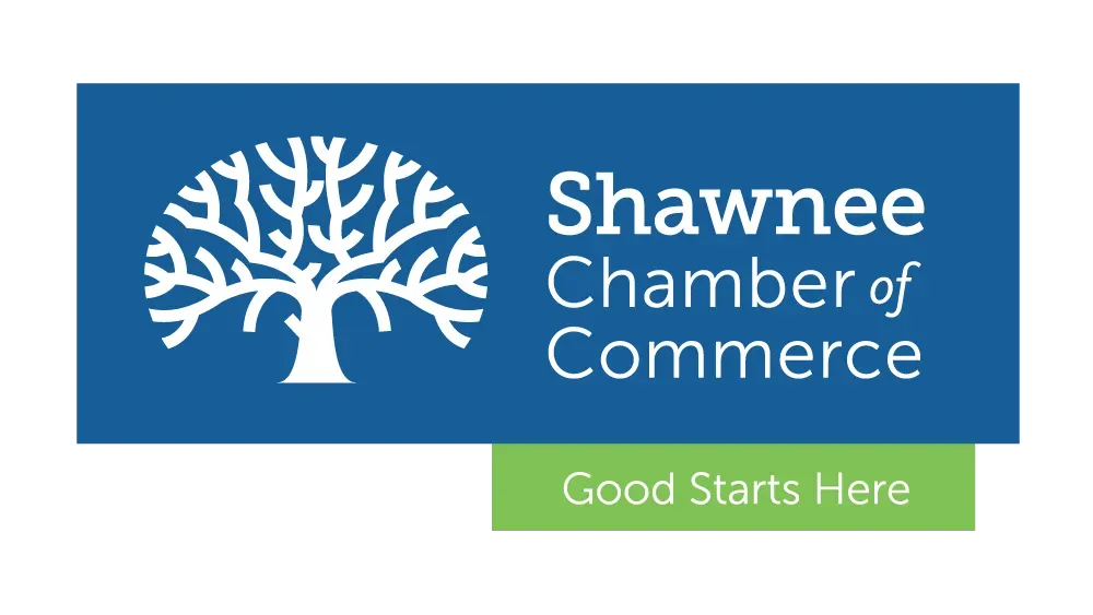 The logo for the shawnee chamber of commerce has a tree on it.