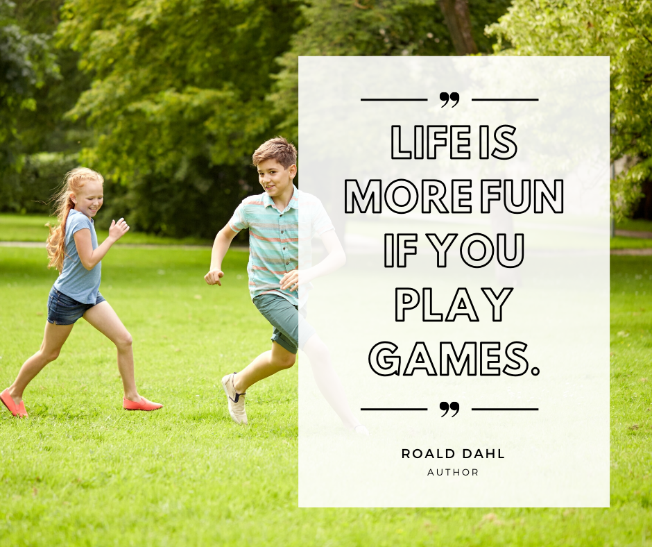 A boy and a girl are playing in a park with a quote that says `` life is more fun if you play games . ''