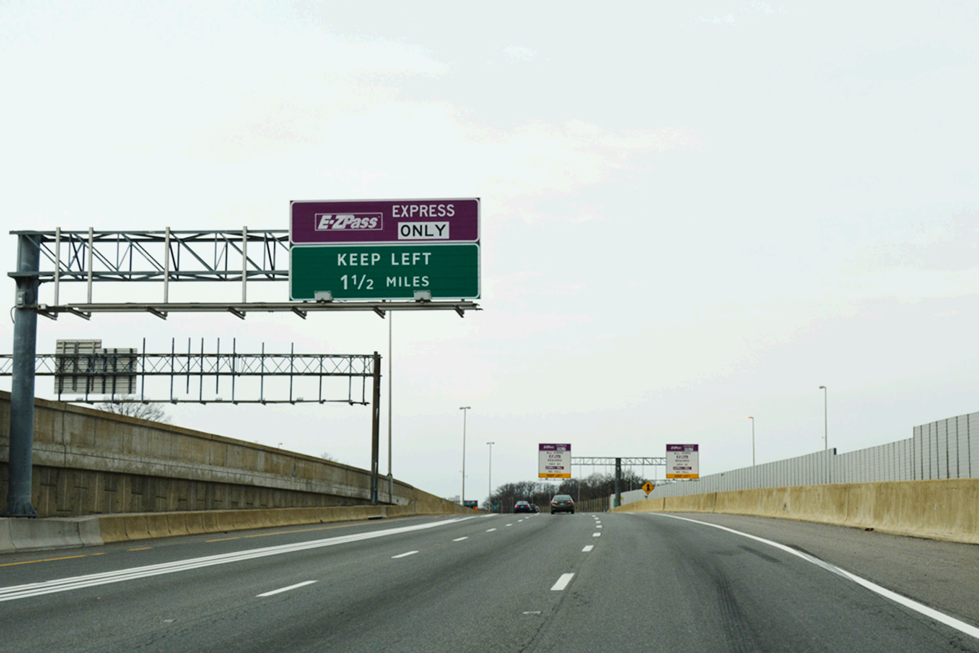Highway sign over a road, reading