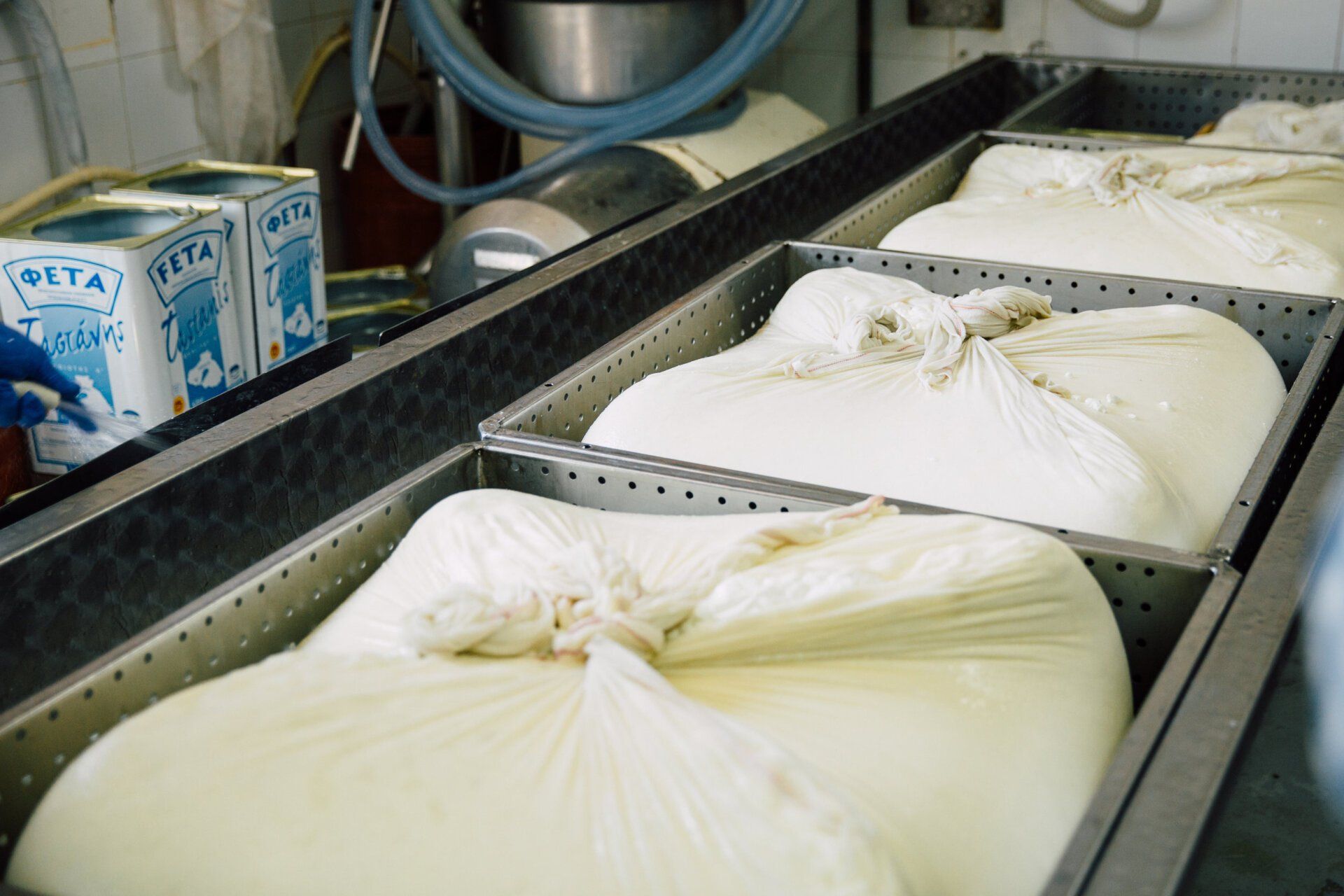 a bunch of bags of milk are sitting on a conveyor belt .