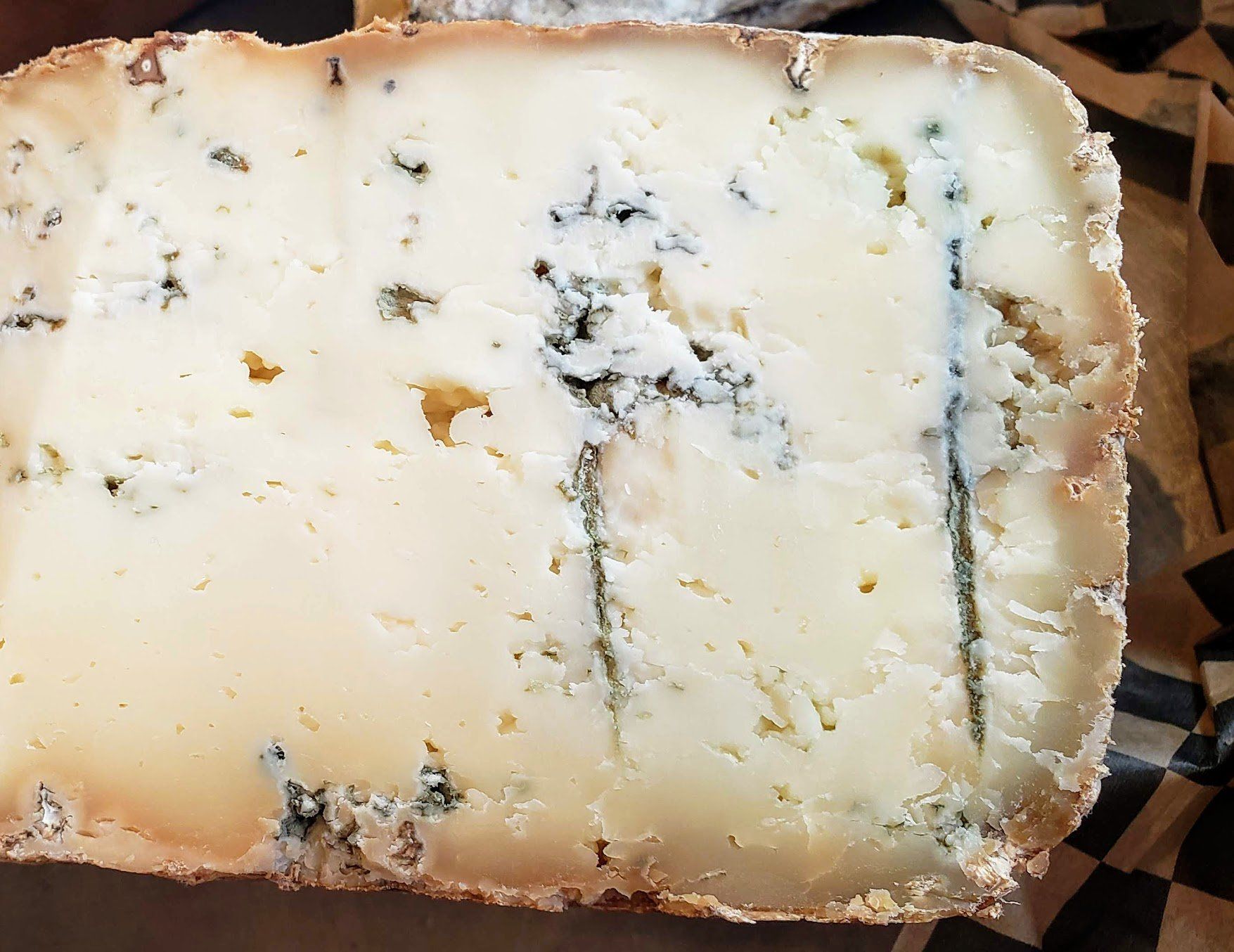 a close up of a piece of cheese on a table
