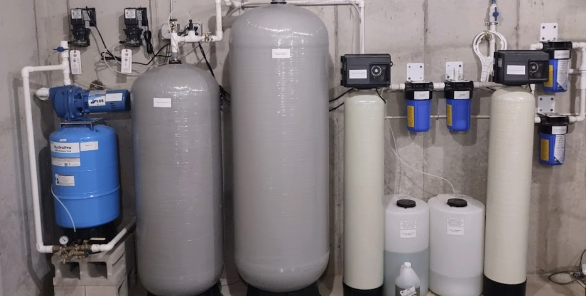 a room filled with water tanks and water filters .