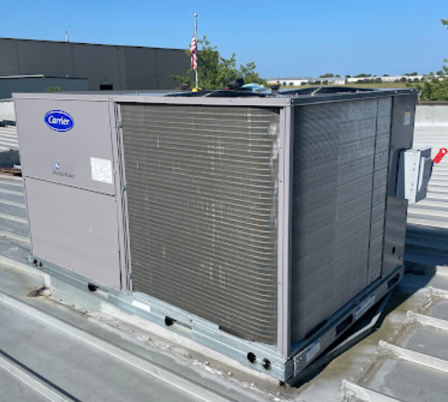 a carrier air conditioner is sitting on top of a roof