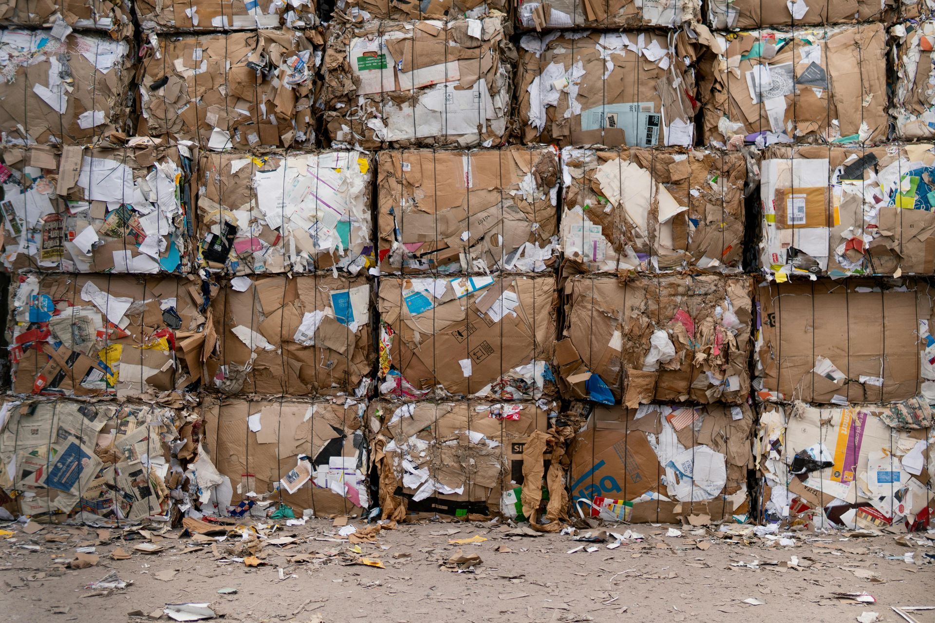 Stacked, compressed cardboard bales, ready for recycling.